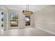 Bright dining room featuring tile floors and a chandelier at 7972 Snowberry Cir, Orlando, FL 32819
