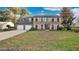 Two-story brick house with a two-car garage and manicured lawn at 7972 Snowberry Cir, Orlando, FL 32819