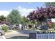 Residential street with houses, landscaping, and a person biking at 110 W Railway Ave, Oakland, FL 34760