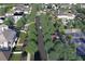 Aerial view of a luxury community with resort-style amenities including a pool and tennis courts at 110 W Railway Ave, Oakland, FL 34760