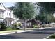 Street view of charming homes with lush landscaping and walking paths at 110 W Railway Ave, Oakland, FL 34760