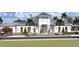 Elegant community clubhouse with white exterior and landscaping at 110 W Railway Ave, Oakland, FL 34760