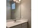 Modern bathroom with a vanity and large mirror at 15102 Stuttgart Aly, Winter Garden, FL 34787