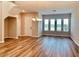 Bright dining room with hardwood floors and large windows at 15102 Stuttgart Aly, Winter Garden, FL 34787