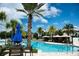 Inviting resort-style pool with comfortable seating and umbrellas at 15102 Stuttgart Aly, Winter Garden, FL 34787