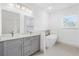 Modern bathroom with double vanity, soaking tub, and tiled floor at 2540 Sw 146Th Pl Rd, Ocala, FL 34473