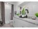 Modern bathroom with double vanity and walk-in shower at 693 Preston Cove Dr, Saint Cloud, FL 34771