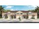 Tan three-unit townhome building with attached garages and landscaping at 701 Preston Cove Dr, Saint Cloud, FL 34771