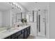 Modern bathroom with double vanity and walk-in shower at 145 Cork Way, Davenport, FL 33897