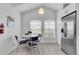 Eat-in kitchen with stainless steel appliances and retro table at 145 Cork Way, Davenport, FL 33897