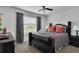 Bedroom with queen-size bed and dark wood frame at 145 Cork Way, Davenport, FL 33897