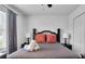 Bedroom with queen-size bed and dark wood frame at 145 Cork Way, Davenport, FL 33897