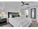 King-size bedroom with ensuite bathroom and large mirror at 145 Cork Way, Davenport, FL 33897