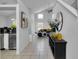 Open entryway with views to living room and kitchen at 145 Cork Way, Davenport, FL 33897