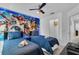 bedroom with twin beds and Marvel superhero mural at 145 Cork Way, Davenport, FL 33897