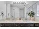 Double vanity bathroom with a large mirror and plenty of counter space at 145 Cork Way, Davenport, FL 33897