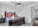 Bedroom with queen-size bed and dark wood frame at 145 Cork Way, Davenport, FL 33897