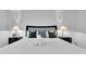 King-size bedroom with nightstands and lamps at 145 Cork Way, Davenport, FL 33897