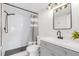 Modern bathroom with subway tile shower and gray vanity at 4878 Conway Rd # 91, Orlando, FL 32812