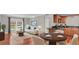 Open living room with hardwood floors, kitchen, and dining area at 4878 Conway Rd # 91, Orlando, FL 32812