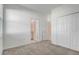 Bedroom with grey carpet, a private bathroom and a large closet at 687 Hitch Loop, Saint Cloud, FL 34772