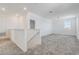 Open loft area with grey carpet and a staircase at 687 Hitch Loop, Saint Cloud, FL 34772