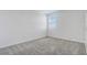 Bright bedroom with grey carpet and a window with blinds at 687 Hitch Loop, Saint Cloud, FL 34772