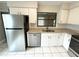Stainless steel appliances and granite countertops in this updated kitchen at 307 Colonade Ct, Kissimmee, FL 34758