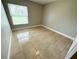 Bright bedroom featuring tile floors and a window at 307 Colonade Ct, Kissimmee, FL 34758