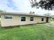 Large backyard with a grassy area and fence at 307 Colonade Ct, Kissimmee, FL 34758