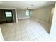 Spacious living room with tile flooring and sliding glass doors at 307 Colonade Ct, Kissimmee, FL 34758