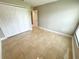Well-lit bedroom with tile floors and a closet at 307 Colonade Ct, Kissimmee, FL 34758