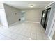 Spacious living area with tile floors and access to the outside at 307 Colonade Ct, Kissimmee, FL 34758