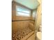 Walk-in shower with tiled walls, seat and floor at 307 Colonade Ct, Kissimmee, FL 34758