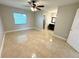 Spacious bedroom with ceiling fan and tile flooring at 307 Colonade Ct, Kissimmee, FL 34758