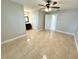 Bright bedroom featuring tile flooring and a ceiling fan at 307 Colonade Ct, Kissimmee, FL 34758