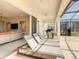 Outdoor patio with lounge chairs and view of living room at 547 Marcello Blvd, Kissimmee, FL 34746