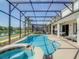 Relaxing pool and spa with screened enclosure at 547 Marcello Blvd, Kissimmee, FL 34746