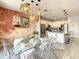 Bright dining room with glass table and statement wall art at 547 Marcello Blvd, Kissimmee, FL 34746