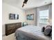 Spacious bedroom with large TV, dresser, and window coverings at 547 Marcello Blvd, Kissimmee, FL 34746