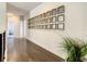 Long hallway with wall of mirrors and hardwood floors at 547 Marcello Blvd, Kissimmee, FL 34746