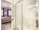 Bathroom with a walk-in shower and view of bedroom at 547 Marcello Blvd, Kissimmee, FL 34746