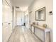 Bright and spacious entryway with tile flooring and a modern console table at 547 Marcello Blvd, Kissimmee, FL 34746