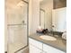 Bathroom with a walk-in shower and modern vanity at 547 Marcello Blvd, Kissimmee, FL 34746