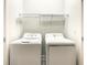 White washer and dryer set in a closet at 547 Marcello Blvd, Kissimmee, FL 34746