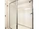 Shower stall with glass enclosure and white subway tile at 547 Marcello Blvd, Kissimmee, FL 34746