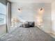 Bright bedroom with wood-like accent wall, comfy bedding, and nightstands at 547 Marcello Blvd, Kissimmee, FL 34746