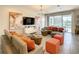 Open living space featuring a sectional sofa and view of the pool at 547 Marcello Blvd, Kissimmee, FL 34746