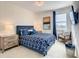 Bedroom with TV, chair, and geometric wallpaper at 547 Marcello Blvd, Kissimmee, FL 34746