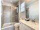 Bathroom with shower, toilet and vanity with white cabinets at 547 Marcello Blvd, Kissimmee, FL 34746